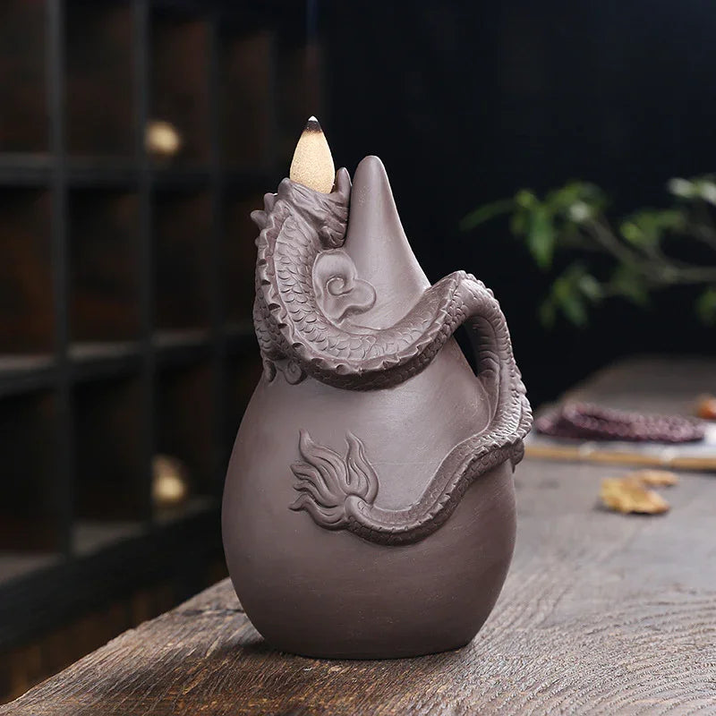 Ceramic dragon incense burner cone on wooden table, decorative home aromatherapy decor